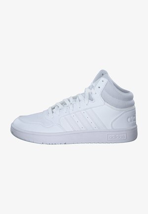 High-top white athletic shoe featuring smooth leather and mesh sections, lace-up front, perforated detailing, and a rubber sole.