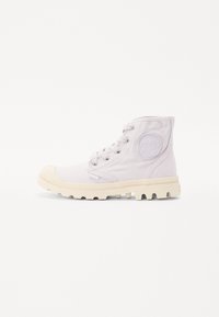 Canvas ankle boot in light lavender with a rubber toe cap, textured sole, lace-up design, and embossed logo detail on the side.