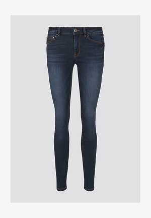 Cienkie dżinsy w ciemnoniebieskim kolorze, z pomarańczowymi przeszyciami, z zapięciem na guzik oraz przednimi kieszeniami. Gładka faktura i dopasowany krój.