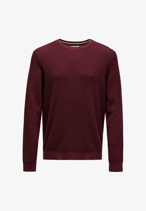 Burgundy knit long-sleeve crewneck sweater with textured pattern and ribbed cuffs and hem, displayed on white background.
