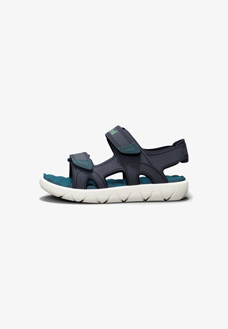 Sandali sportivi con tomaia sintetica blu scuro, soletta imbottita turchese, suola in gomma bianca e cinturini regolabili in Velcro per una vestibilità sicura.