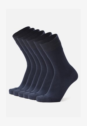 Marine Crew-Socken im 6er-Pack. Aus weichem, dehnbarem Stoff mit gerippten Bündchen. Glatte Textur, strukturierte Form und verstärkte Zehen.