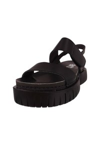 Sandalias negras con una suela gruesa y estriada, tiras cruzadas y un respaldo ajustable para un ajuste seguro. Fabricadas en material sintético suave.