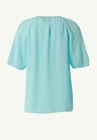 Light blue short-sleeve blouse with a gathered neckline and soft, smooth fabric. Features slightly puffed sleeves and a loose fit.