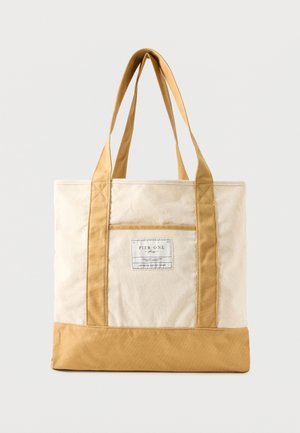 Leinwandtasche in Beige und Braun mit langen Griffen und einer Vordertasche mit Pier One-Label.