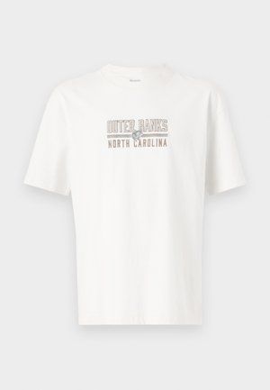 White cotton t-shirt with short sleeves, featuring "OUTER BANKS NORTH CAROLINA" printed in gray and subtle gold accents.