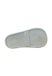 Suela de zapato blanca de goma con un patrón de diamantes texturizado y bordes lisos. Presenta una marca registrada en relieve y una indicación del tamaño en el costado.