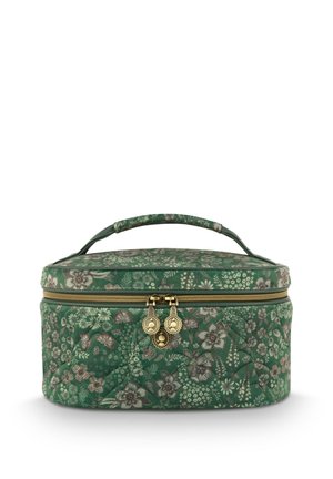 Green floral-patterned quilted cosmetic case with gold zipper, dual pull tabs, and padded handle. Round shape with a flat base.