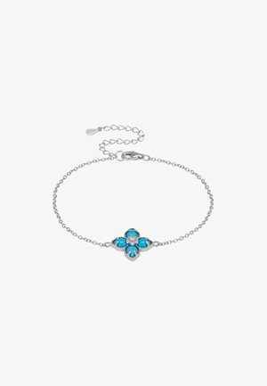 Bracelet en chaîne en argent présentant un pendentif en forme de fleur en turquoise, avec une pierre précieuse claire centrale et des détails complexes.