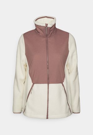 Fleece-takki vetoketjulla, jossa on vaaleanpunainen yläosa ja valkoinen alaosa. Korkea kaulus ja kaksi sivuvetoketjullista taskua. Pehmeä rakenne.