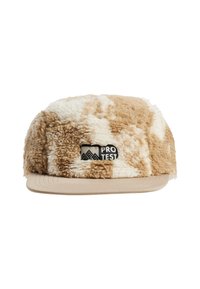 Tan and cream faux fur cap with a flat brim and a black "PRO TEST" logo tag. Textured surface with a soft appearance.