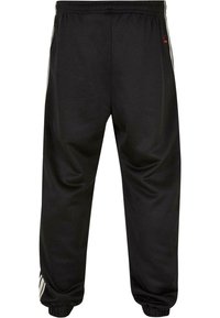 Sorte joggebukser med en glat tekstur, som har en innsnevret passform, elastisk midje og kontrasterende hvite sidelister.