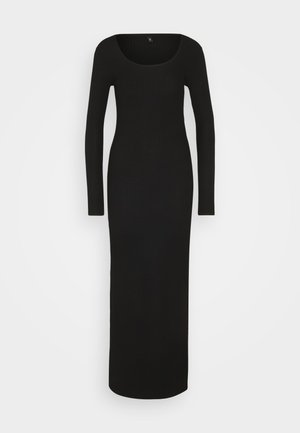 Μαύρο, μακρυμάνικο ριμπ φόρεμα με στρογγυλή λαιμόκοψη και εφαρμοστή γραμμή, που φτάνει μέχρι το πάτωμα. Λείο ύφασμα και εφαρμοστό σχέδιο.