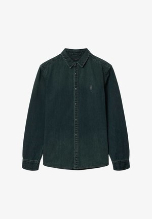 Musta pitkähihainen farkkupaita, jossa on kaulus, napit ja vasemmassa rinnassa pieni kirjailtu logo.