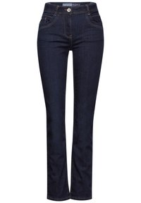 Vaqueros de mezclilla azul oscuro con un diseño de pierna recta, estilo de cinco bolsillos y costuras en contraste a lo largo de las costuras. Etiqueta en el cinturón tono sobre tono.