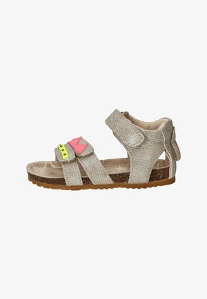 Sandale beige pour enfants avec trois sangles réglables, accents décoratifs roses et jaunes, lit plantaire en liège et semelle en caoutchouc.