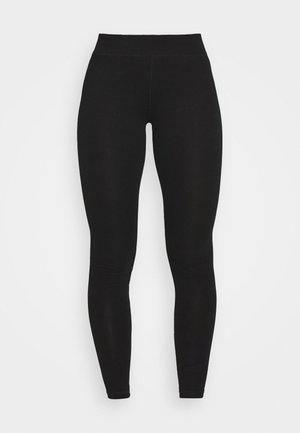 Mustad mustriga mustad leggings'id, mis on valmistatud venivast ja siledast kangast. Omab kõrget vöökohaga ja keha lähedalt istuvat disaini, ulatudes pahkluuni ning ilma mustriteta.