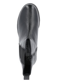 Musta nahkasaapas nilkkapituisena, jolla on sivuvetoketju, vetotappi takana ja elastinen paneeli, näkymä ylhäältä.