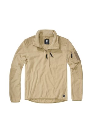 Beżowy polarowy pulower z kołnierzem na zamek do ćwiartki, kieszenią na lewym ramieniu i teksturowanym materiałem na ciele. Posiada metkę z literą "B" na dole po lewej stronie.