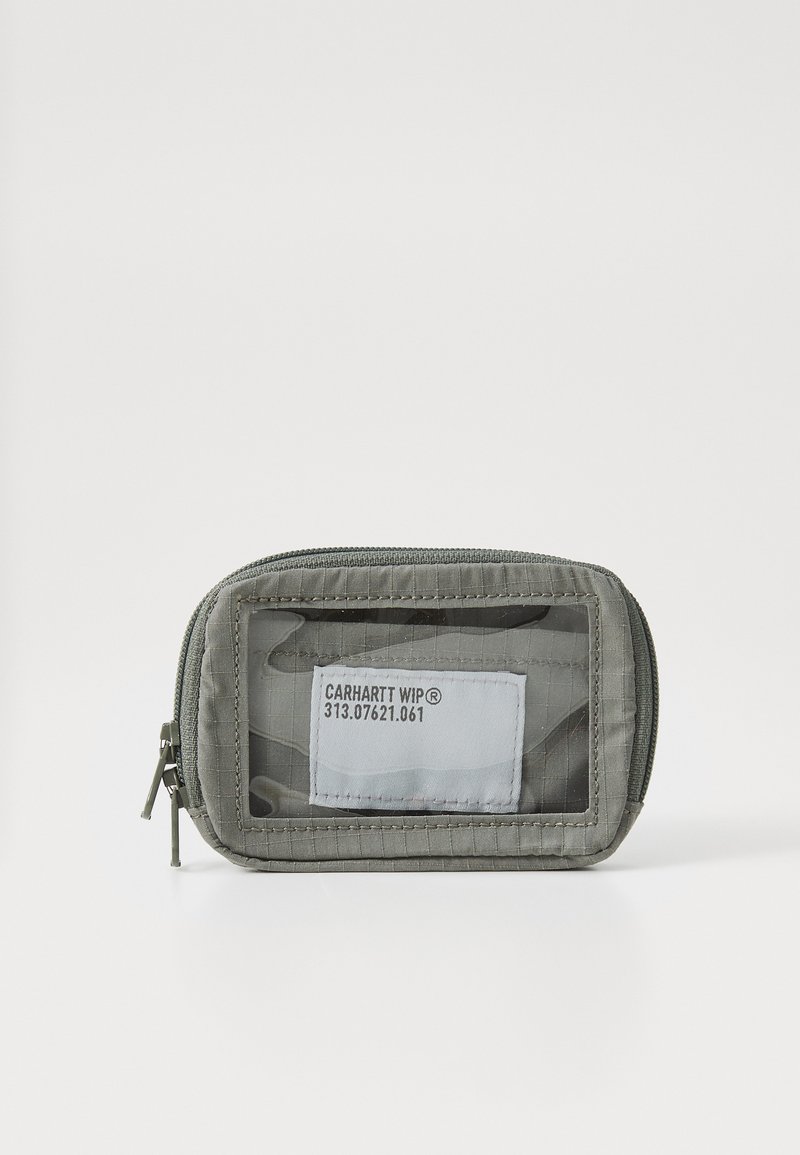 Small gray zippered pouch with transparent front, textured surface, and label reading "CARHARTT WIP® 313.07621.061." Compact and functional design.