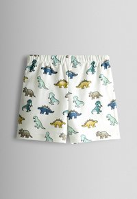 Białe szorty dla malucha z elastycznym pasem, ozdobione wielokolorowymi wzorami z kreskówkowymi dinozaurami w kolorach niebieskim, zielonym, żółtym i brązowym.