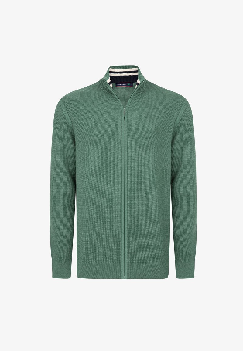 Groene ritscardigan, gemaakt van textuurgebreide stof. Heeft een staande kraag met een gestreepte binnenvoering. Lange mouwen en een effen kleur overal.