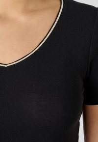 Damart MANCHES COURTES THERMOLACTYL SENSITIVE - Maglietta intima - noir