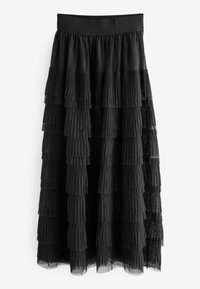 Jupe noire à volants avec des plis superposés et des accents transparents. Ceinture élastique et textures variées créent de la dimension et du mouvement.