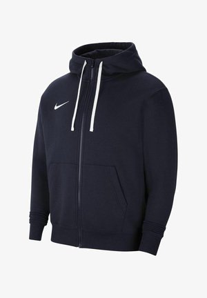 Laivastonsininen vetoketjullinen huppari, jossa valkoiset nyörit, etutaskut, resorikäänteet ja valkoinen Nike Swoosh -logo vasemmassa rinnassa.