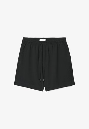 Schwarze Freizeithose mit elastischem Bund, Kordelzug, Seitentaschen und einem kleinen weißen Markenetikett in der Mitte des Bunds.