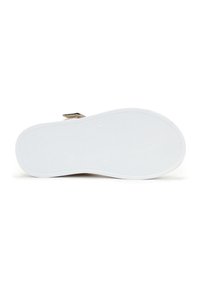 Witte rubberen schoenzool met een gestructureerd grippatroon, met een lichte kromming aan de randen en een gladde afwerking in de buurt van de hiel.