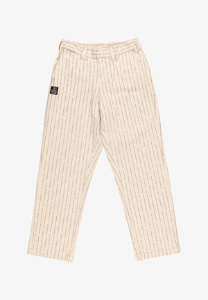 Beige pants with vertical text pattern, featuring a belt loop, side pockets, and a black brand label on the left side.