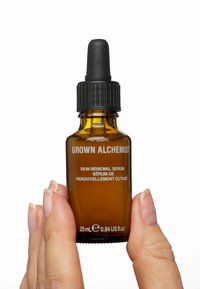 Brown glass dropper bottle with black lid. Label reads "GROWN ALCHEMIST SKIN RENEWAL SERUM." Volume: 25 mL (0.84 US fl. oz.).