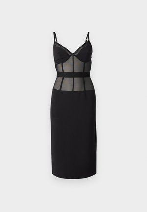 Black dress featuring a sheer mesh bodice with underwire cups, structured waist, and a fitted skirt with a side slit. Adjustable straps.