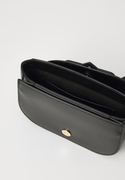 Black leather handbag with a smooth texture, featuring a gold-tone button closure and multiple interior compartments for organization.