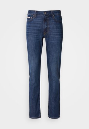 Dunkelblaue Jeans aus Denim mit geradem Schnitt, Fünf-Taschen-Design, Knopfverschluss und dezenten Ausbleichungen auf der Vorderseite.