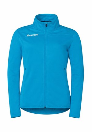 Heldere blauwe jas met volledige ritssluiting, hoge kraag, lange mouwen en "Kempa"-logo op de linkerborst, ontworpen voor outdoor- of sportkleding.