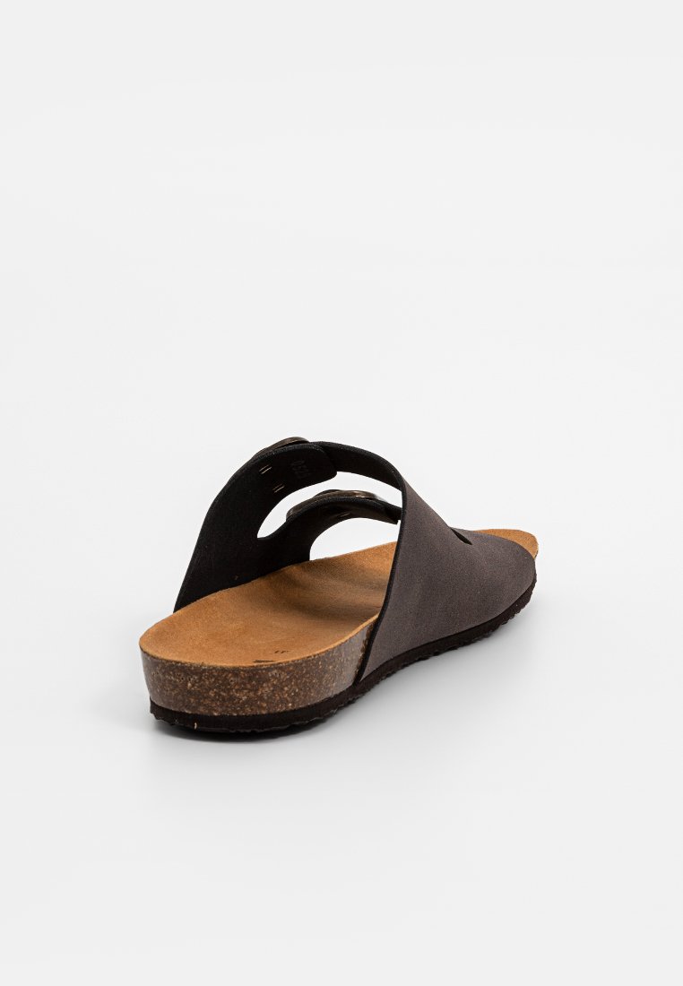 Sandale noire avec semelle en liège, forme sculptée et design à bout ouvert. Dispose de deux brides pour le soutien et d'une semelle extérieure texturée pour une meilleure adhérence.
