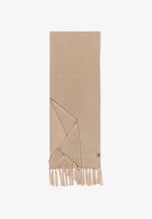 Beige woven textile scarf with fringed ends, folded at one corner, and a small rectangular label near the bottom edge.