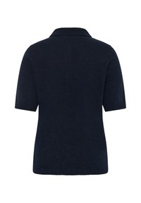 Pull en maille bleu marine à manches courtes avec un col retourné, montré de dos sur fond blanc.