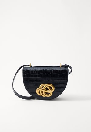 Black crocodile-embossed handbag with a rounded shape, gold-tone metal hardware, and a decorative intertwined accent on the front.