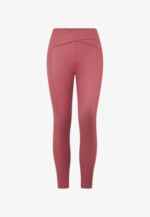 Vaaleanpunaiset korkeavyötäröiset leggingsit, joissa on ristiin menevä vyötärönauha, sileä pinta ja litteät saumat lisämukavuutta varten.