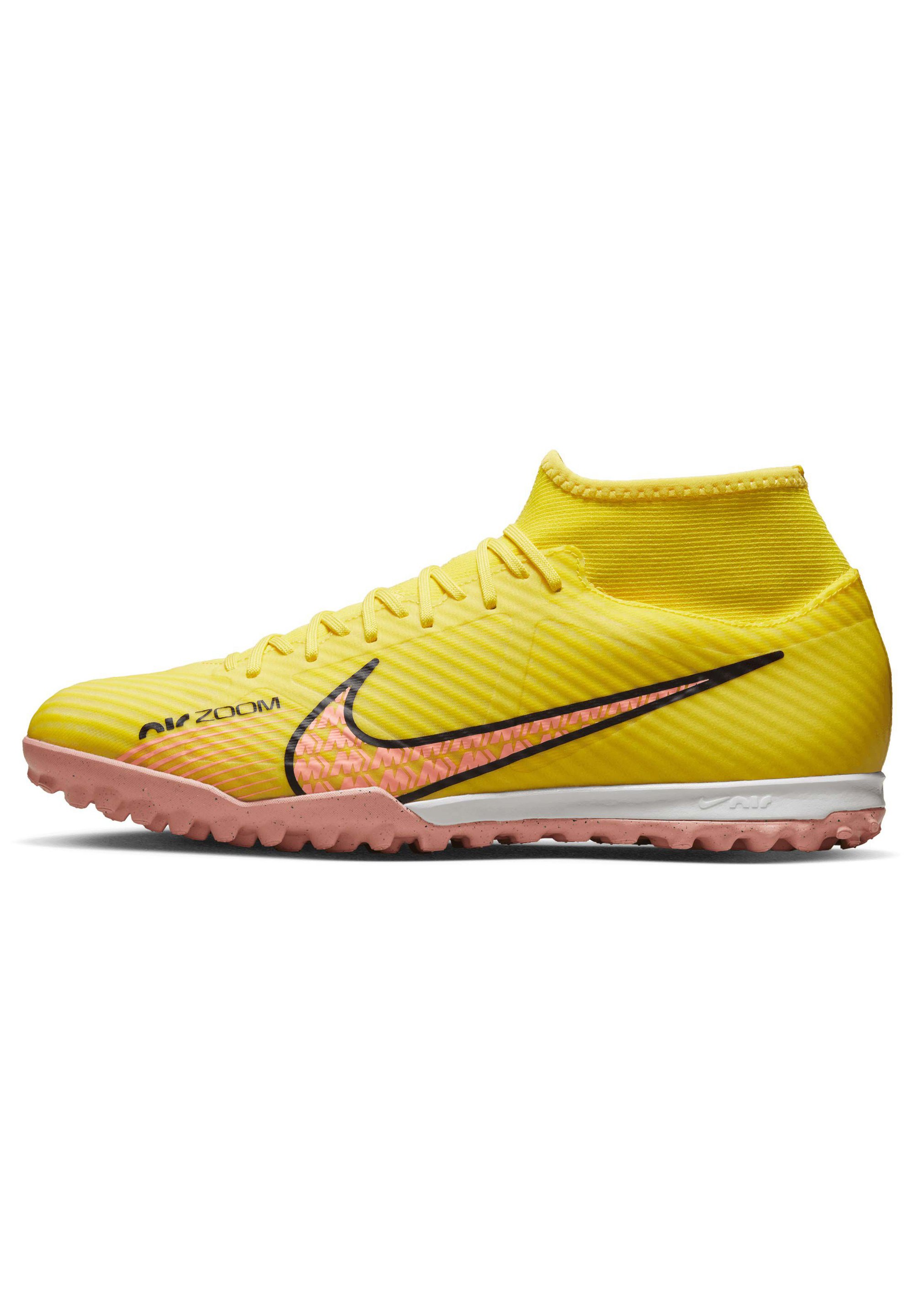 yellow nike astro turf