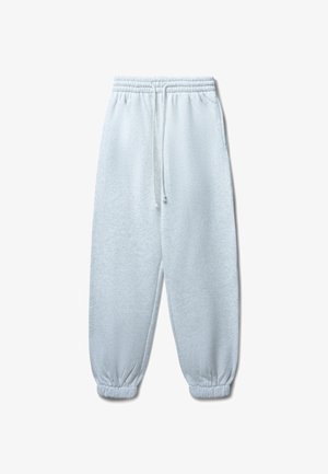 Pantaloni della tuta grigio chiaro realizzati in tessuto morbido, con vita elastica e coulisse e polsini arricciati alle caviglie.