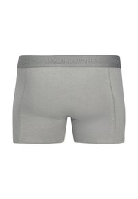 Gray men's boxer briefs with elastic waistband featuring "JACK & JONES" branding in matching gray tone.