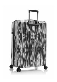 Maleta rígida con un patrón de rayas de cebra en blanco y negro, mango telescópico único y cuatro ruedas giratorias para una fácil movilidad.