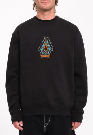Zwarte sweatshirt met een centraal grafisch ontwerp in blauw en oranje, met ingewikkelde details rond de randen. Zachte textuur, geribde manchetten.