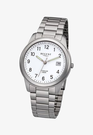 Silver titanium wristwatch with white face, black numerals, date window at 3, and metal link band showing time 10:10:36.