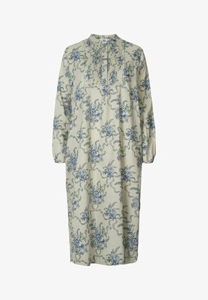 Cvetna obleka iz lahkega materiala, ki vsebuje modre in zelene botanične vzorce, dolge rokave, ovratnik in detajle z naborki spredaj.