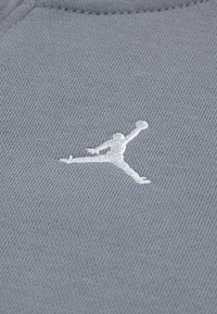 Jordan UNISEX - Tracksuit - black/starfish